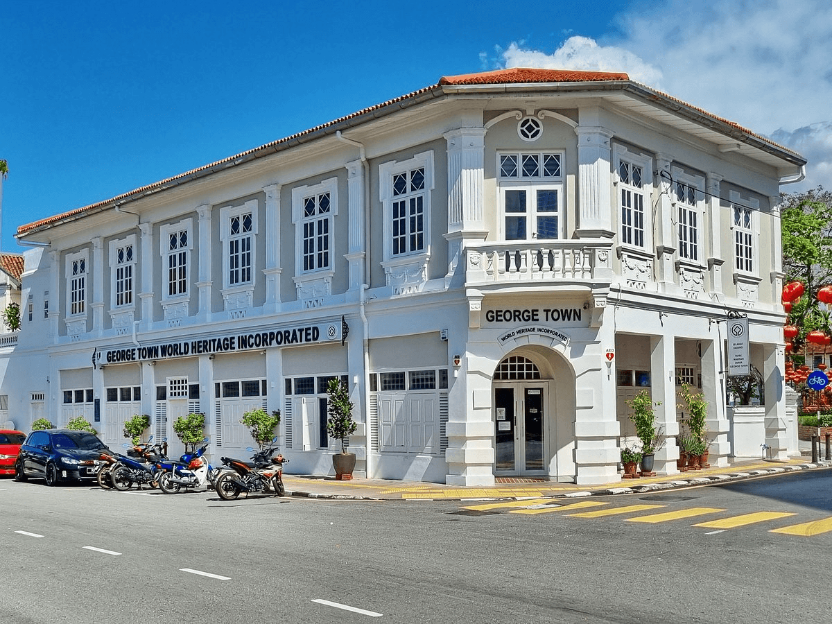 White George Town heritage building with shuttered windows and a tiled roof